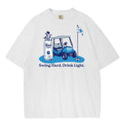 A white short-sleeve t-shirt featuring a blue graphic of a golf cart, a golf bag, a flag, and the text 'Swing Hard, Drink Light.' printed on the front.