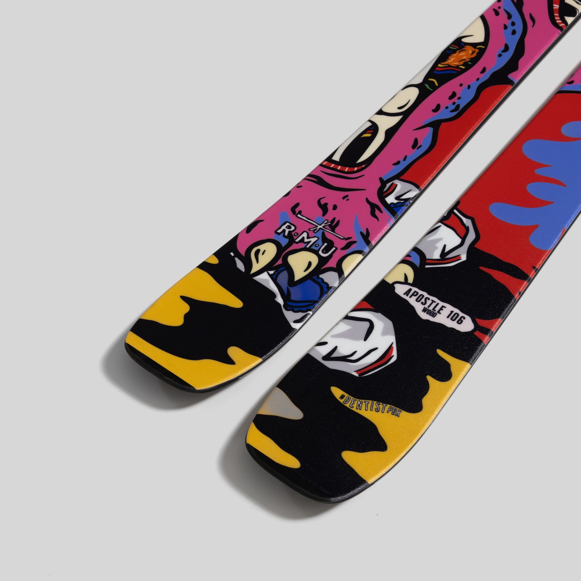 Colorful skateboard with graphic design on a gray background